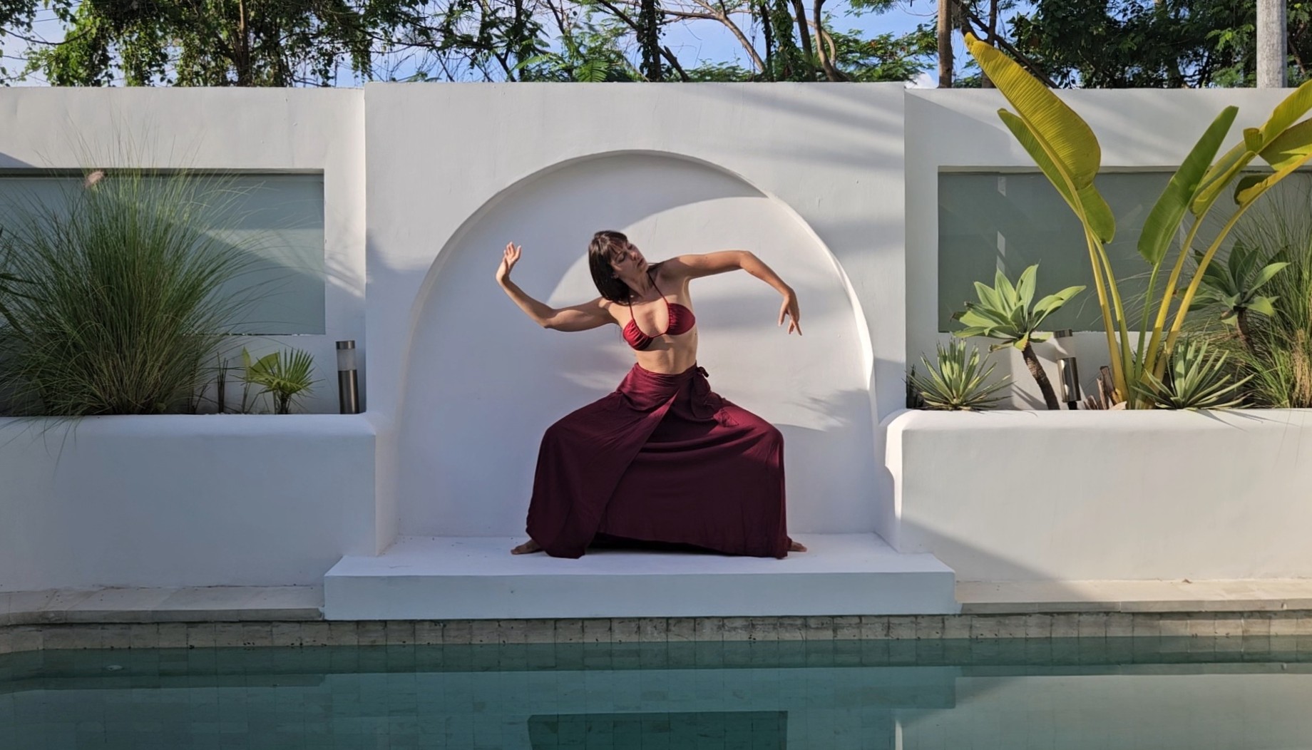 Woman in red dress dancing — Return to Rhythm